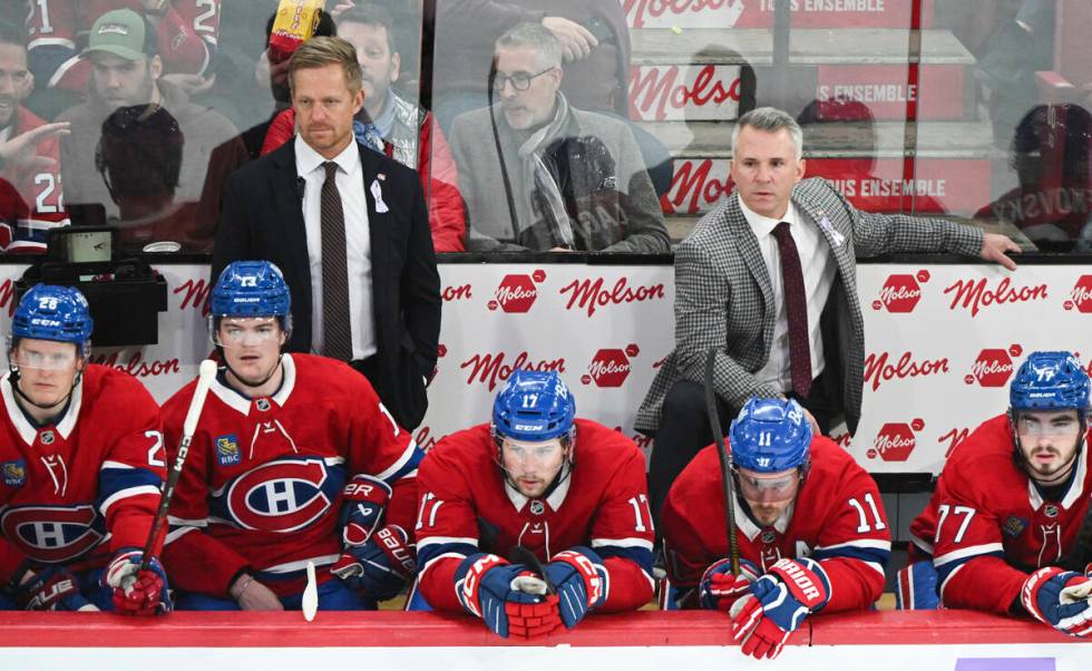 Montreal Canadiens head coach Martin St-Louis, right, and assistant coach Trevor Letowski, left ...