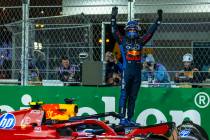 Red Bull Racing driver Max Verstappen celebrates his championship win for the season at the fin ...