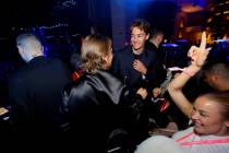 F1 Las Vegas Grand Prix champ George Russell is shown with EDM superstars Swedish House Mafia a ...