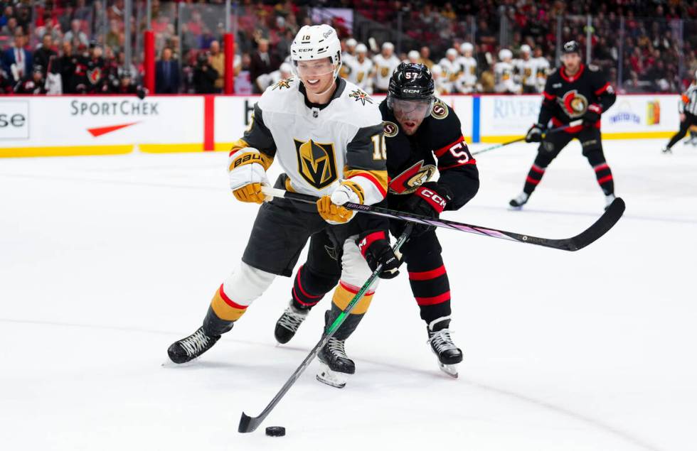 Ottawa Senators left wing David Perron (57) takes the puck from Vegas Golden Knights left wing ...