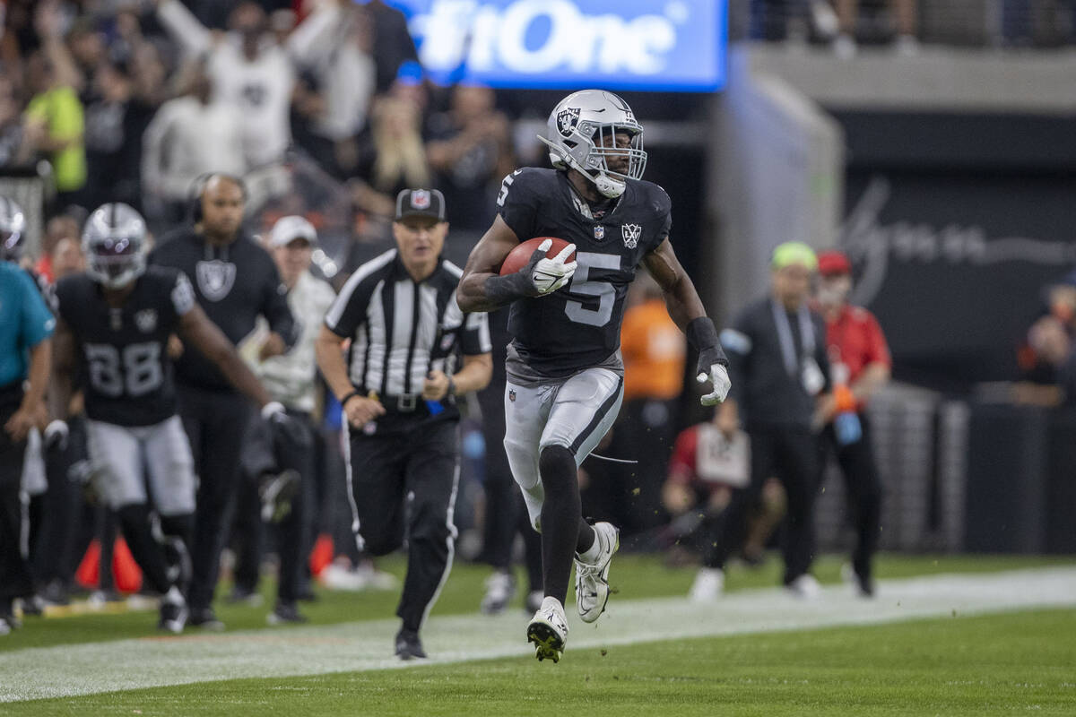 Raiders linebacker Divine Deablo (5) runs with the football on a fake punt during the first hal ...