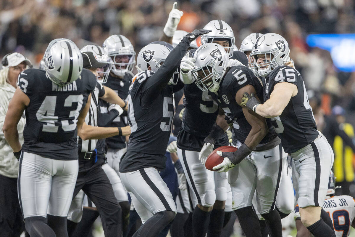 Raiders linebacker Divine Deablo (5) teammates, from left, long snapper Jacob Bobenmoyer (50), ...