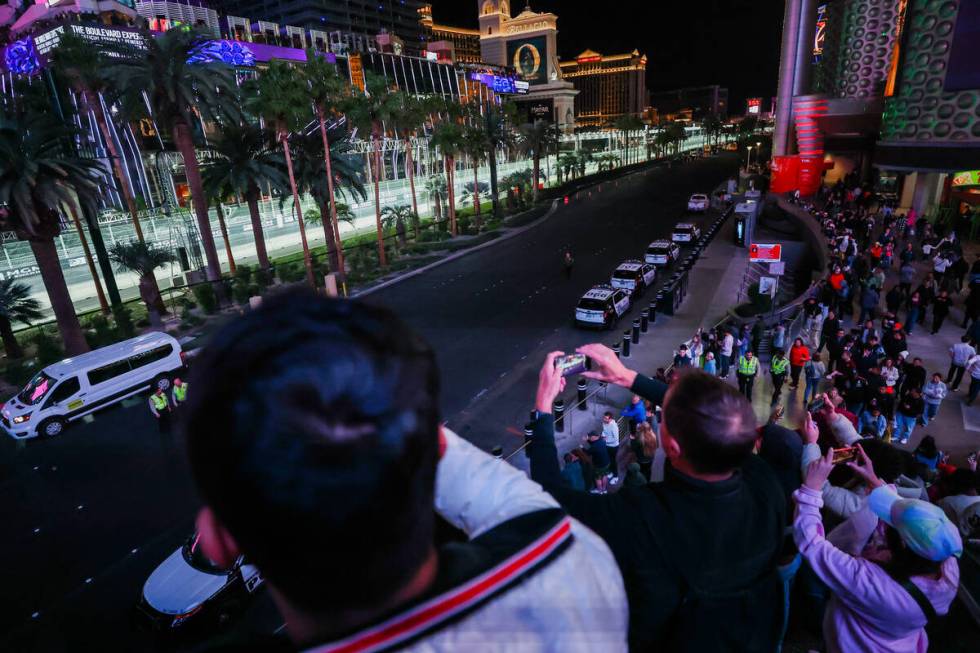 Formula 1 fans ride up and down an escalator to get a better view of the race during the Formul ...