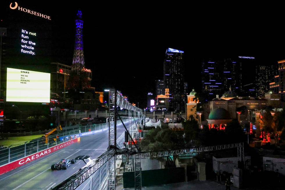 A race car driver navigates the circuit during the Formula 1 Las Vegas Grand Prix on the Strip ...