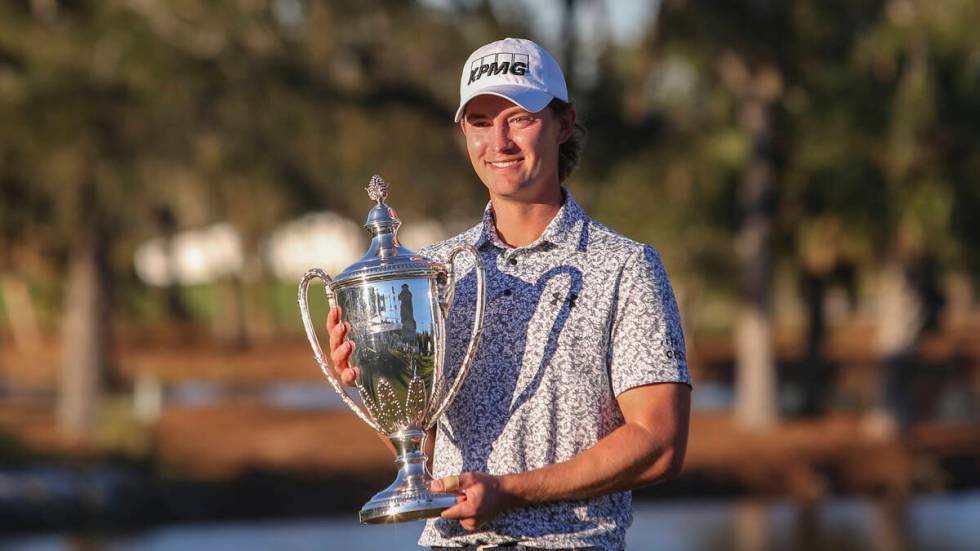 Maverick McNealy holds the trophy after the final round of the RSM Classic golf tournament, Sun ...