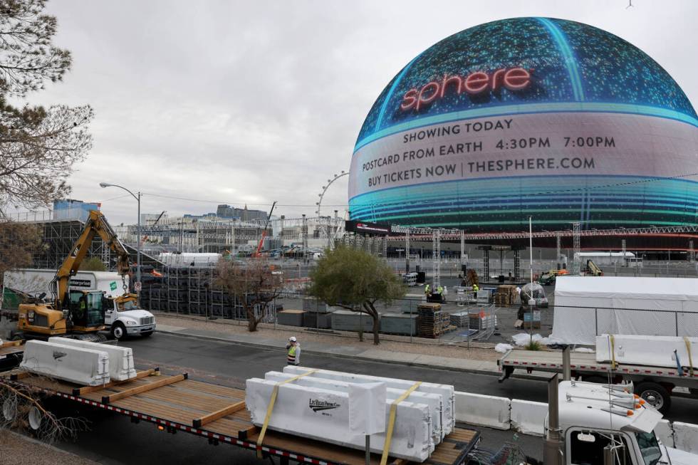 Workers dismantle the Formula One Las Vegas Grand Prix track off Sands Avenue near Sphere in L ...