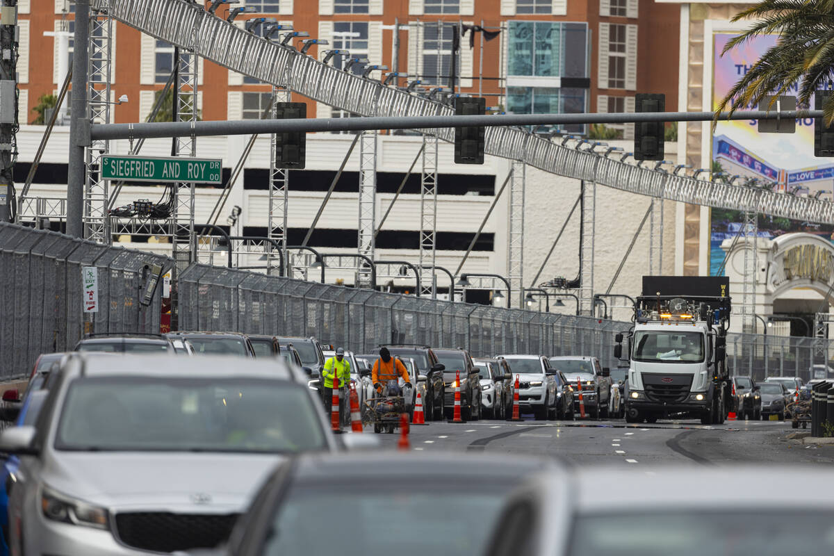 Lane markings are repainted as the Formula One Las Vegas Grand Prix track is dismantled along L ...