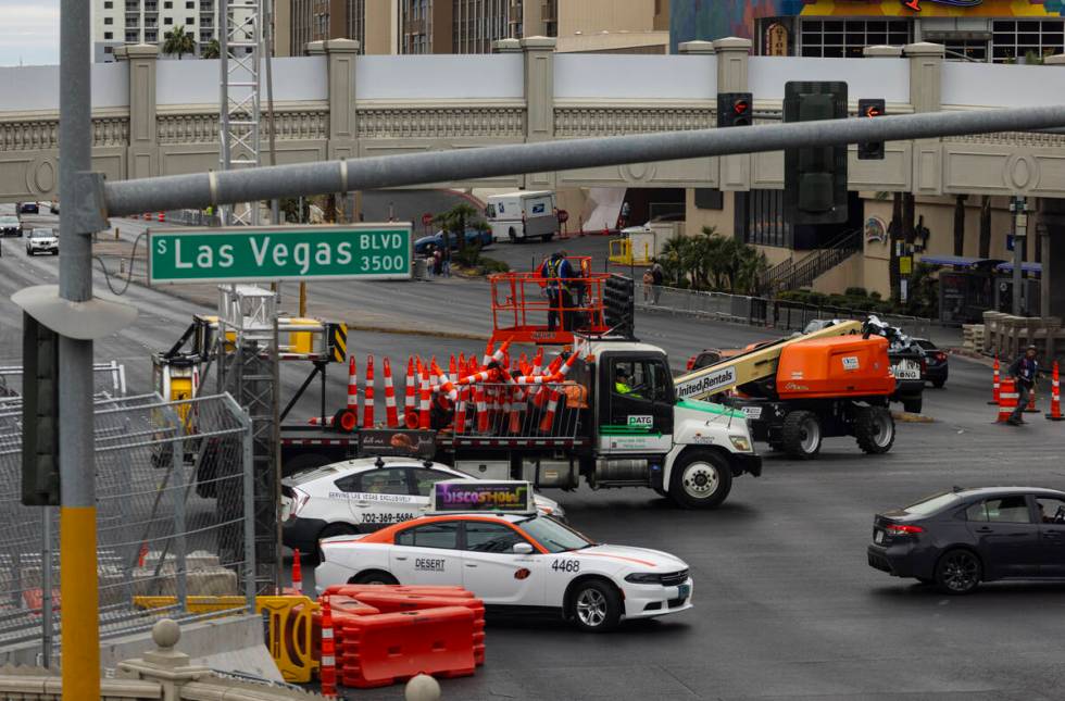 Crews work to take down the Formula One Las Vegas Grand Prix track along Las Vegas Boulevard at ...