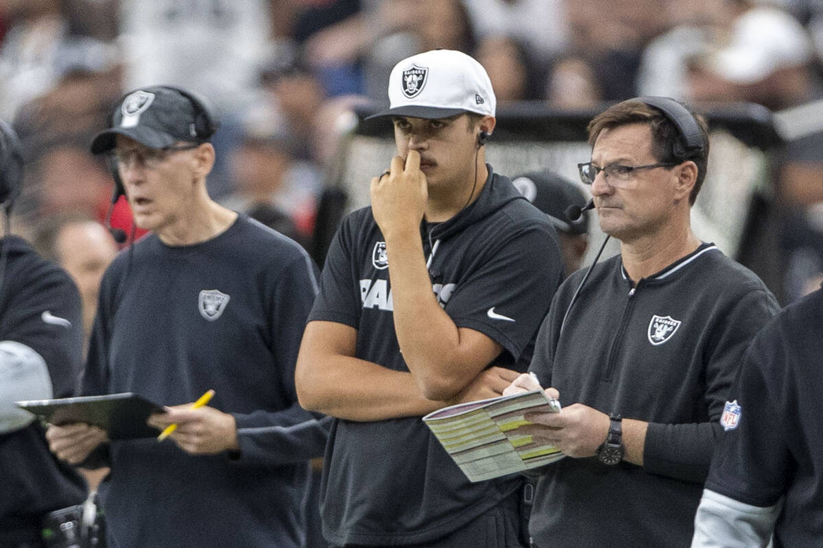 Raiders quarterback Aidan O'Connell, center, watches the team play the Kansas City Chiefs durin ...