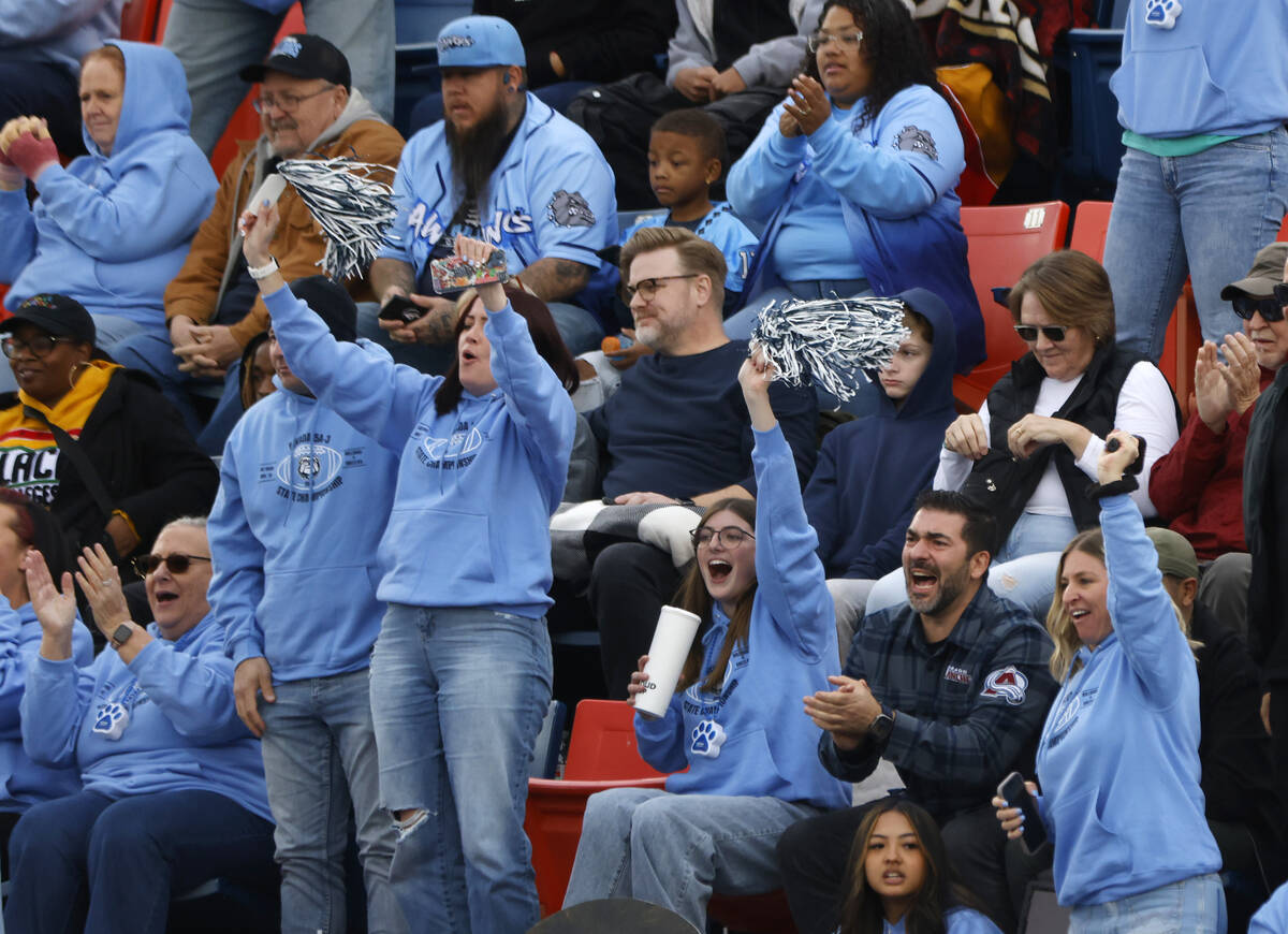 Centennial High fans cheer for their team during their Class 5A Division III football state cha ...