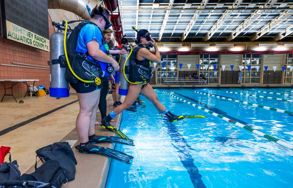 A student enters the water during a Sin City Scuba class at the Whitney Ranch Aquatic Center on ...