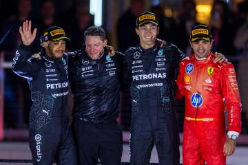 Mercedes driver Lewis Hamilton, a teammate and George Russell with Ferrari driver Carlos Sainz ...