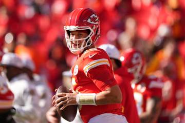 Kansas City Chiefs quarterback Patrick Mahomes warms up before an NFL football game against the ...