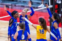 San Jose State setter Brooke Slusser (10) celebrates a point with teammates against UNLV during ...