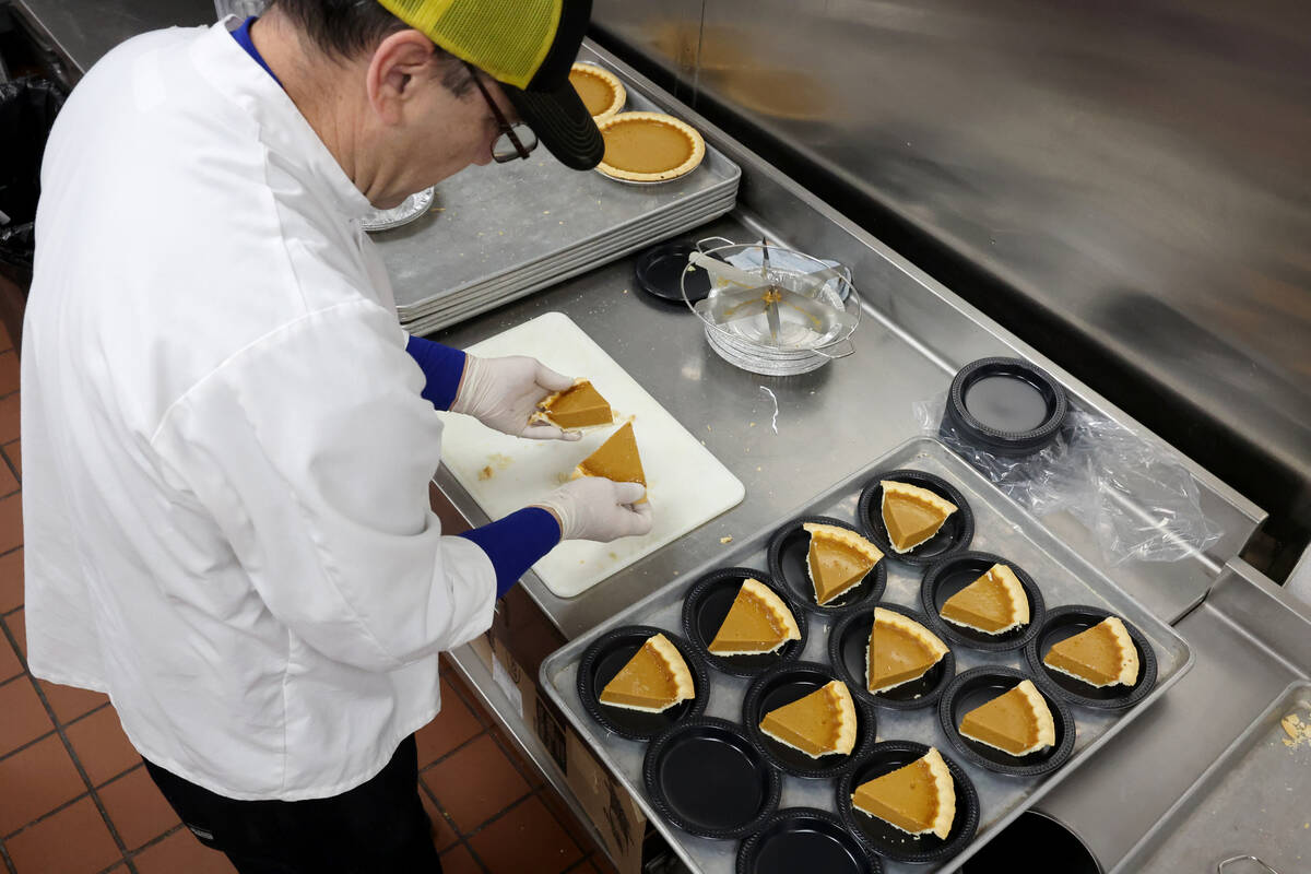 Sous chef Alberto Moncada prepares pie for 700 Thanksgiving meals at Catholic Charities of Sout ...