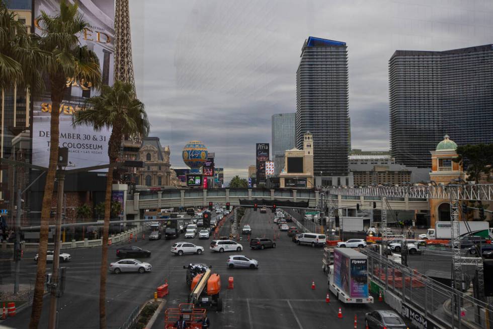 Traffic moves along Flamingo Road at Las Vegas Boulevard as clouds hover above on Monday, Nov. ...