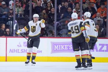 Vegas Golden Knights' Jack Eichel, from left, celebrates with Ivan Barbashev and Brayden McNabb ...