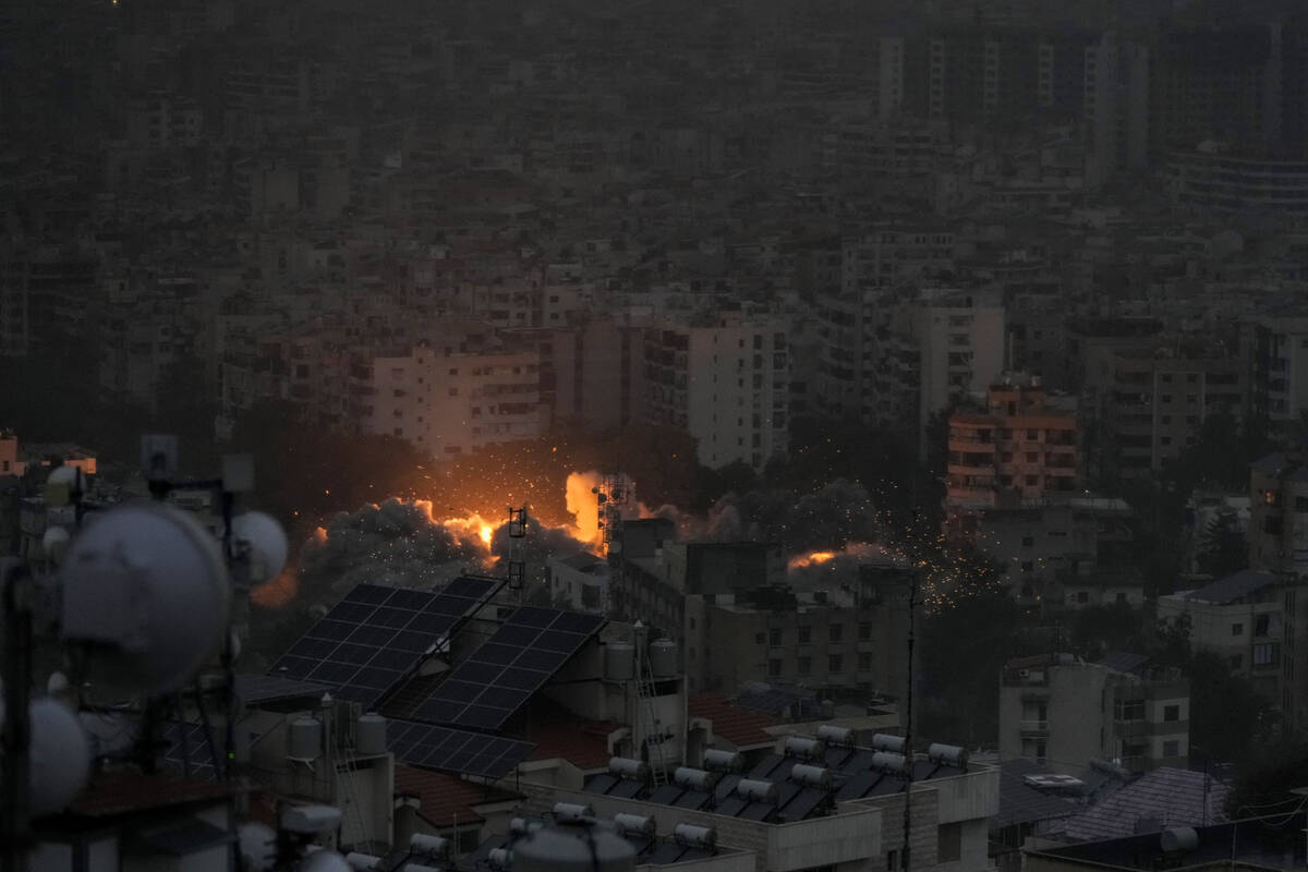 Smoke and flame rise after an Israeli airstrike on Dahiyeh, in Beirut, Lebanon, Monday, Nov. 25 ...