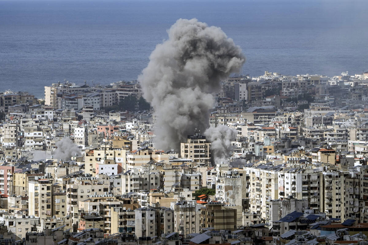 Smoke rises after an Israeli airstrike on Dahiyeh, in the southern suburb of Beirut, Lebanon, M ...