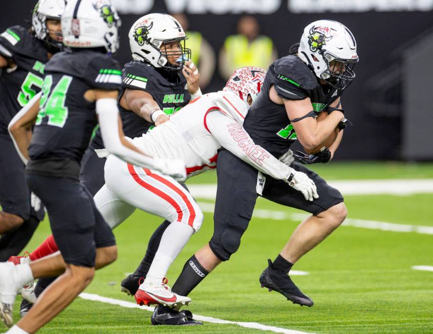 SLAM Academy senior Dylan Tondreau, right, runs with an intercepted ball during the Class 3A fo ...