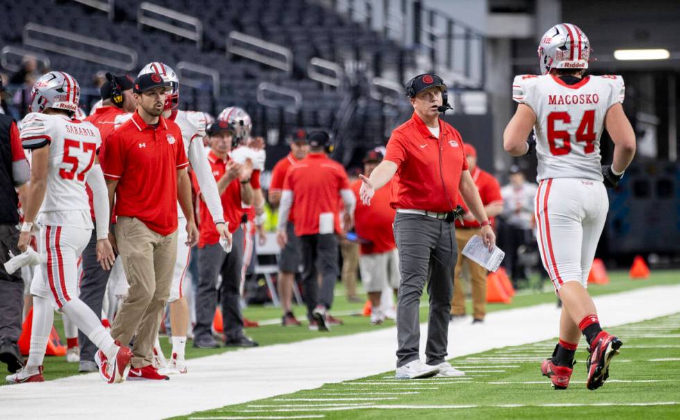 Truckee Head Coach Josh Ivens welcomes his players back to the sideline after a scoring drive d ...