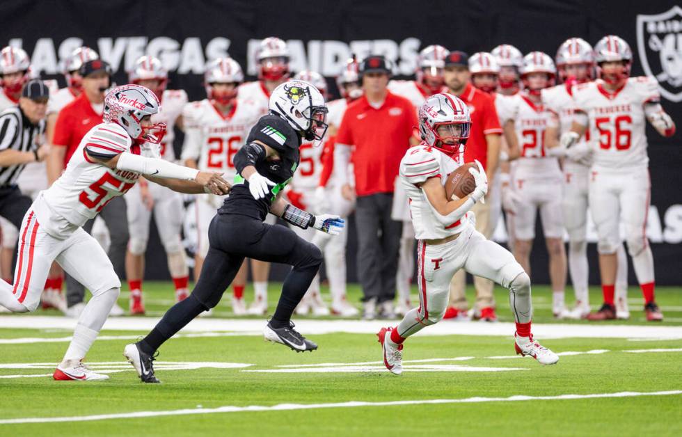 Truckee sophomore Ivan Esparza (24) runs with the ball during the Class 3A football state champ ...