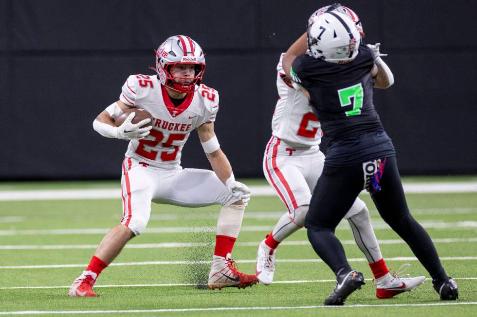 Truckee senior Joseph Birnbaum (25) runs with the ball during the Class 3A football state champ ...