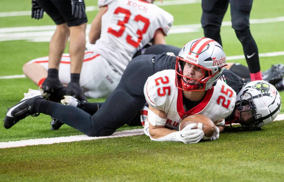 Truckee senior Joseph Birnbaum (25) looks for a referee’s signal of a touchdown during t ...