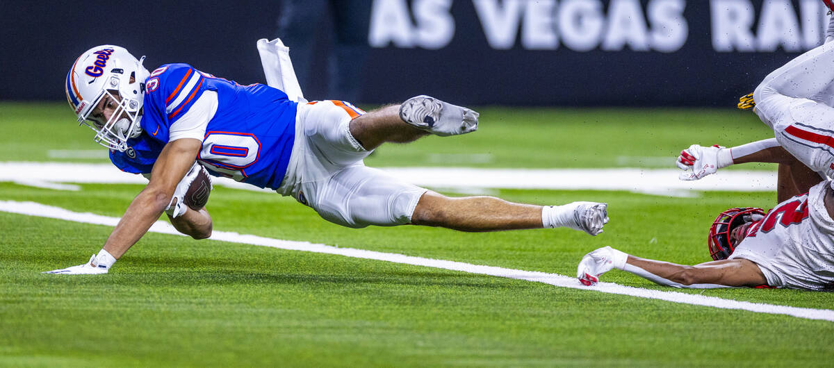 Bishop Gorman wide receiver Derek Meadows (30) dives into the end zone after a long pass recept ...