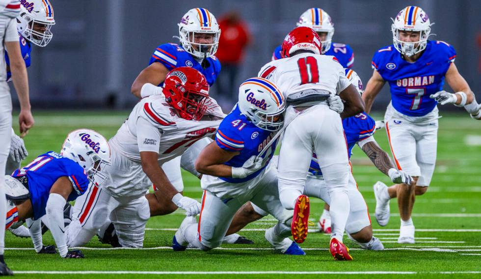 Arbor View running back Kamareion Bell (0) is stopped by Bishop Gorman defensive lineman Prince ...