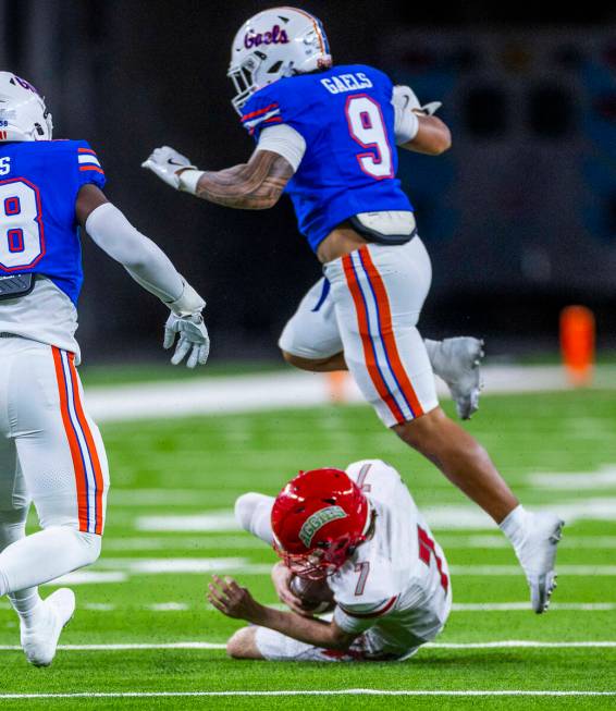 Arbor View quarterback Thaddeus Thatcher (7) slides for a first down as Bishop Gorman linebacke ...