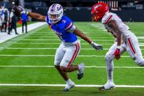 Bishop Gorman running back Terrance Grant (3) beats Arbor View safety Damien Dixon Jr. (12) to ...