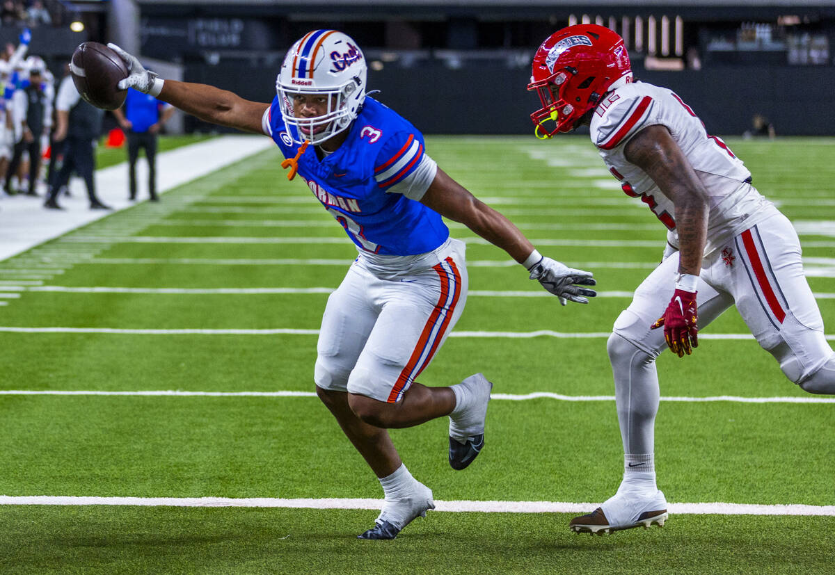 Bishop Gorman running back Terrance Grant (3) beats Arbor View safety Damien Dixon Jr. (12) to ...