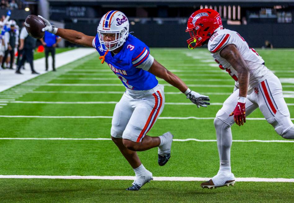 Bishop Gorman running back Terrance Grant (3) beats Arbor View safety Damien Dixon Jr. (12) to ...