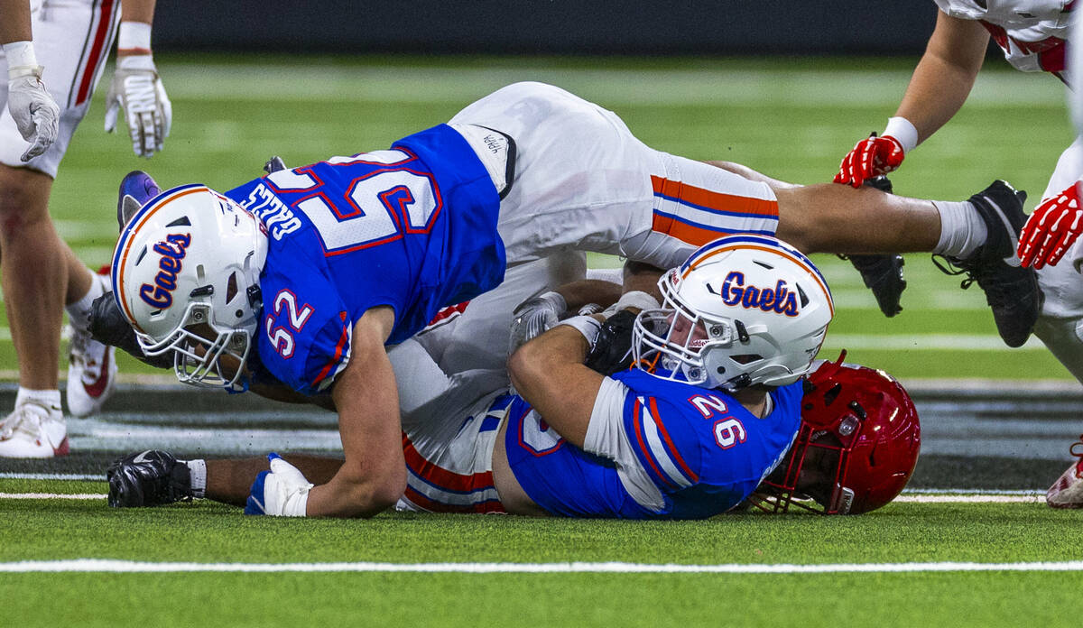 Bishop Gorman linebacker Aksel Ferry (26) secures an onside kick against Arbor View as teammat ...