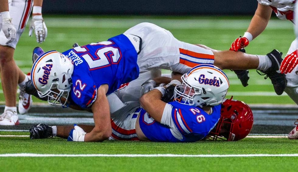 Bishop Gorman linebacker Aksel Ferry (26) secures an onside kick against Arbor View as teammat ...