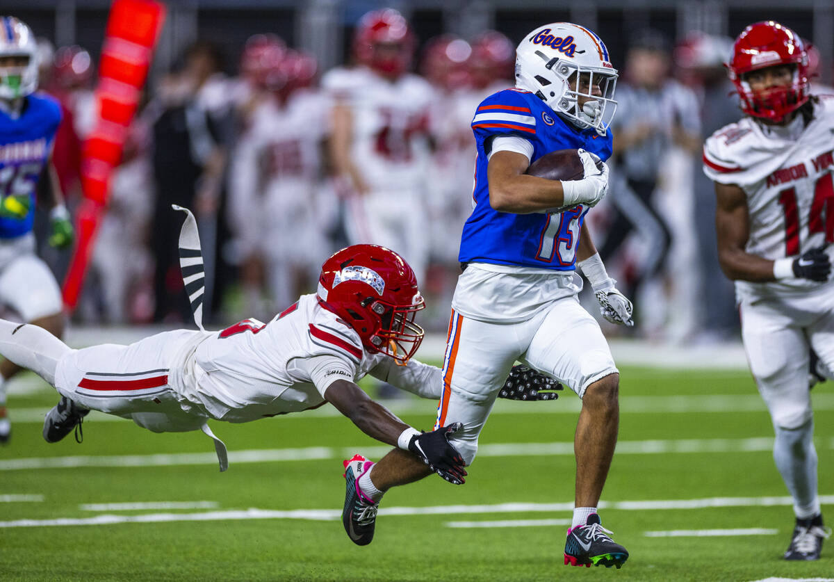 Bishop Gorman wide receiver Aizen Torres (13) heads for the end zone as Arbor View cornerback T ...