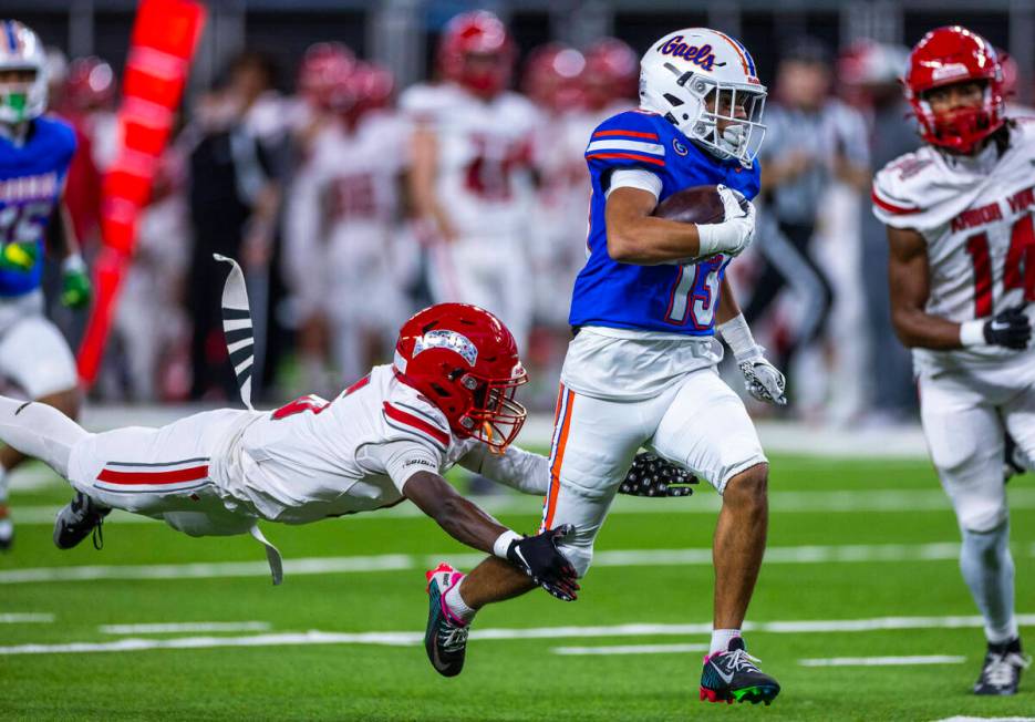 Bishop Gorman wide receiver Aizen Torres (13) heads for the end zone as Arbor View cornerback T ...