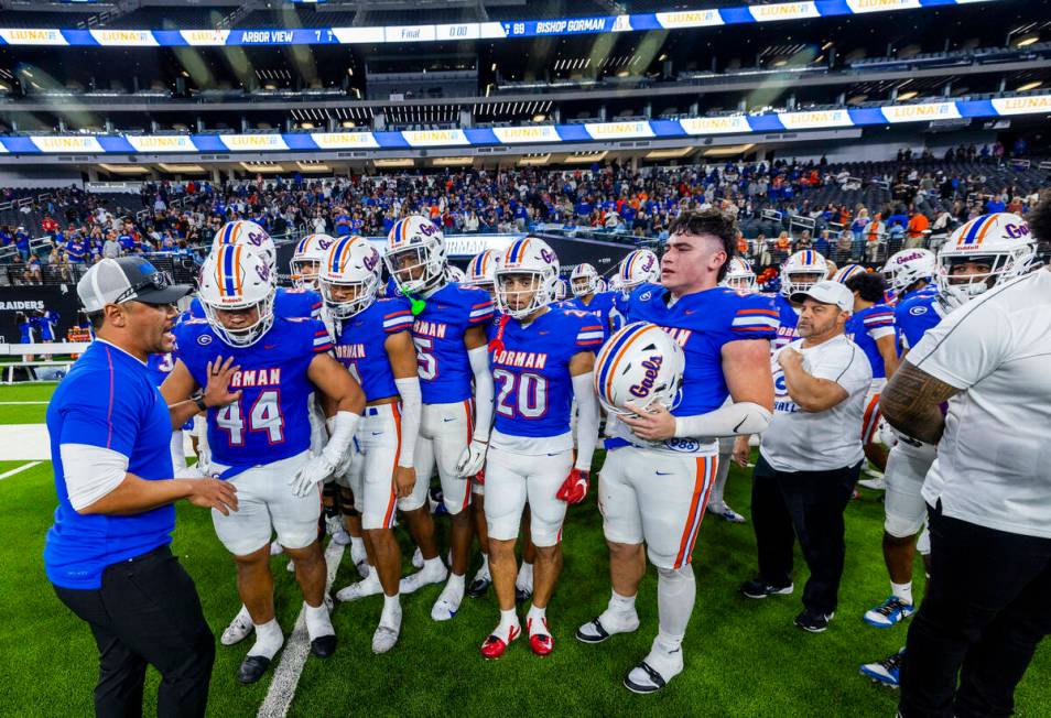 Bishop Gorman head coach Brent Browner counsels his players to be respectful as they will greet ...