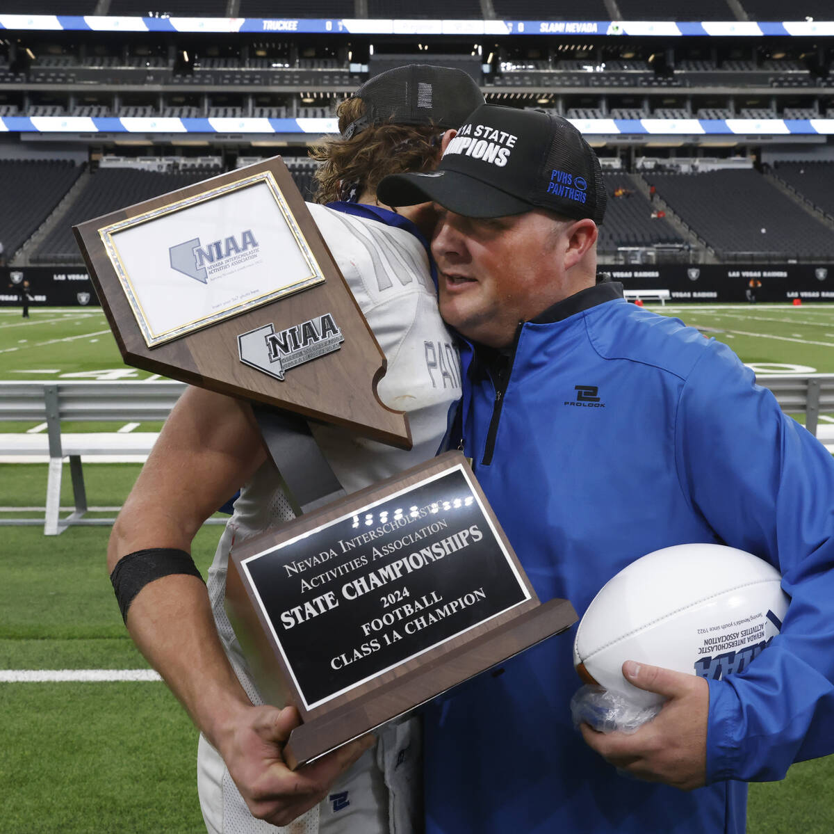 Pahranagat Valley quarterback Jesse Stewart (5) and head coach Brett Hansen congratulate each o ...