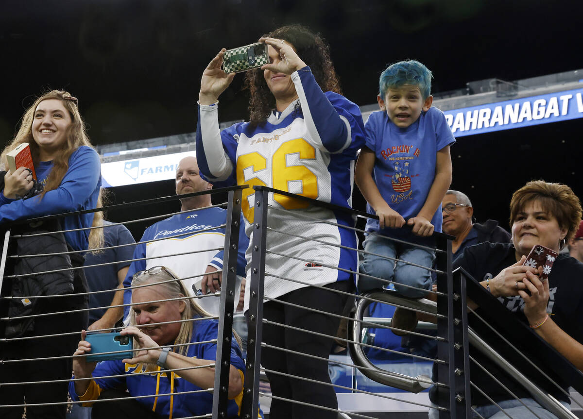 Pahranagat Valley fans take pictures of players after topping Tonopah 28-6 to win the state Cla ...