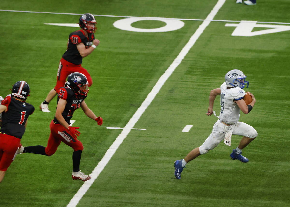 Pahranagat Valley quarterback Jesse Stewart (5) runs through Tonopah's defense for a touchdown ...