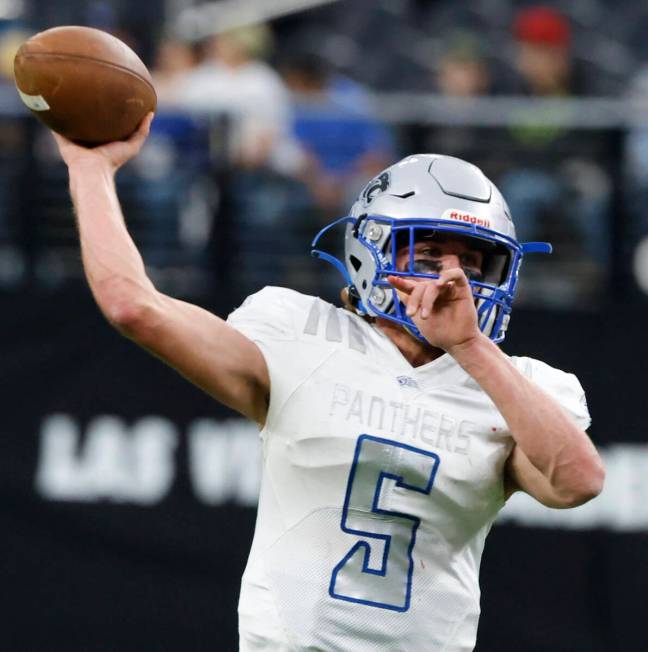 Pahranagat Valley quarterback Jesse Stewart (5) throws against Tonopah during their state Class ...