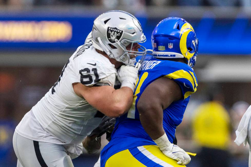 Raiders guard Jordan Meredith (61) blocks Los Angeles Rams defensive tackle Kobie Turner (91) d ...