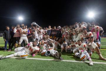 Mojave celebrates the 32-21 win over Losee after the high school 4A Desert League title footbal ...