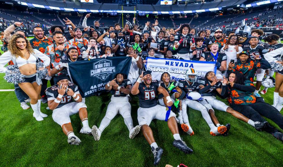 Mojave players and coaches celebrate their 30-6 win over Canyon Springs during their Class 4A f ...