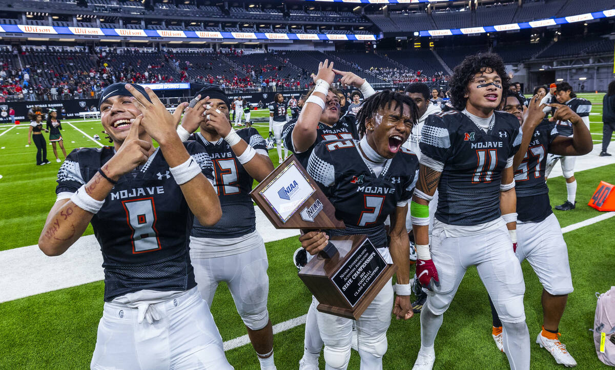 Mojave players celebrate their 30-6 win over Canyon Springs during their Class 4A football stat ...