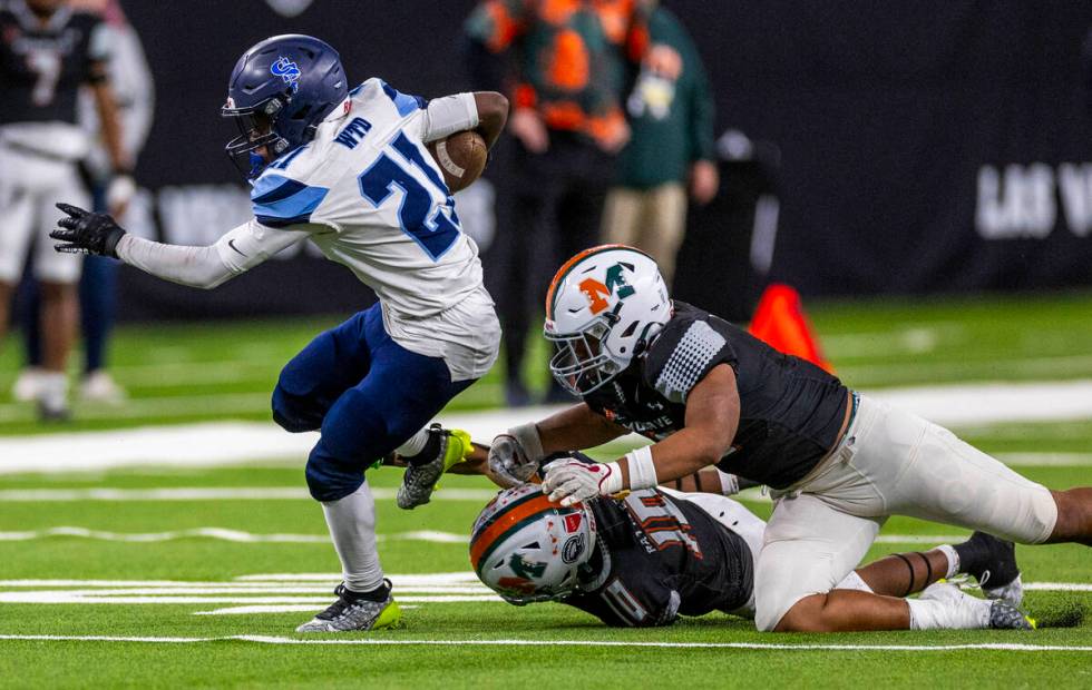 Canyon Springs running back Bakari Wilson (21) breaks free against Mojave during the second hal ...