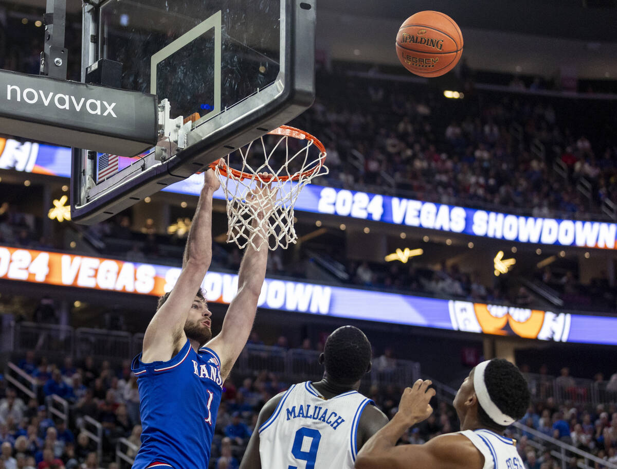 Kansas Jayhawks center Hunter Dickinson (1) watches the ball fly off the rim after missing a du ...