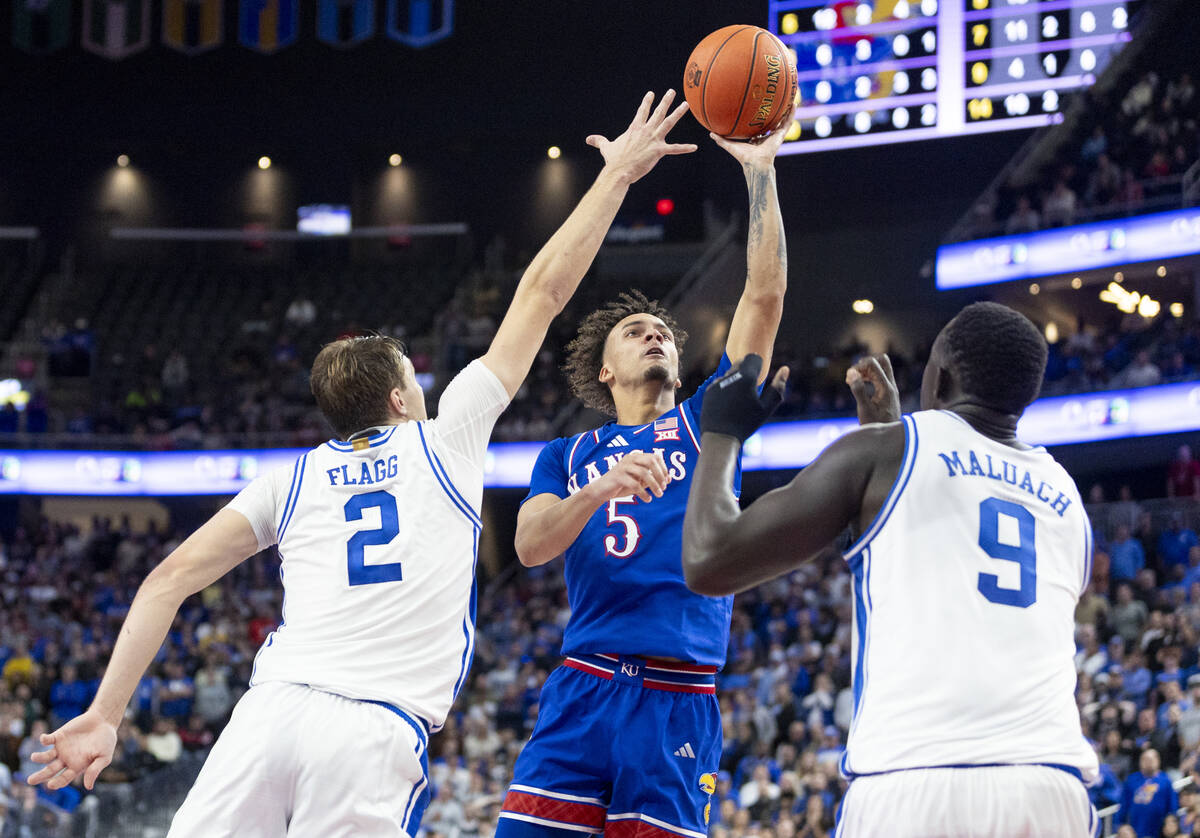 Kansas Jayhawks guard Zeke Mayo (5) attempts a shot during the Vegas Showdown college basketbal ...